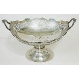 A twin handled and pierced silver presentation trophy bowl inscribed 'Presented to Clement Clueit on