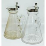 A matched pair of 1920s silver mounted glass whisky tots or typical conical form, Hukin & Heath,