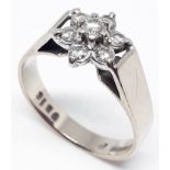 A hallmarked 18ct white gold diamond cluster ring, flower head cluster diam. approx. 9mm, gross