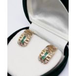 A pair of 18ct gold emerald earrings, gross wt. 5.5g.