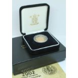 A 2002 reverse design sovereign, boxed with booklet.