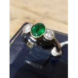 A diamond and emerald ring, the oval cut emerald measuring approx. 7.85mm x 6.10mm x 3.75mm, approx.