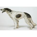 An Austrian cold painted bronze dog, impressed 'Austria', length 12.5cm.
