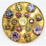 A modernist 18ct gold multi gemstone brooch by Kurt Jobst, formed as a shield and set with 15