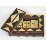 A 19th century bone domino set, possibly prisoner of war or Royal Navy, mahogany construction formed