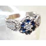 A hallmarked 9ct gold diamond sapphire cluster ring, gross wt. 3.1g.