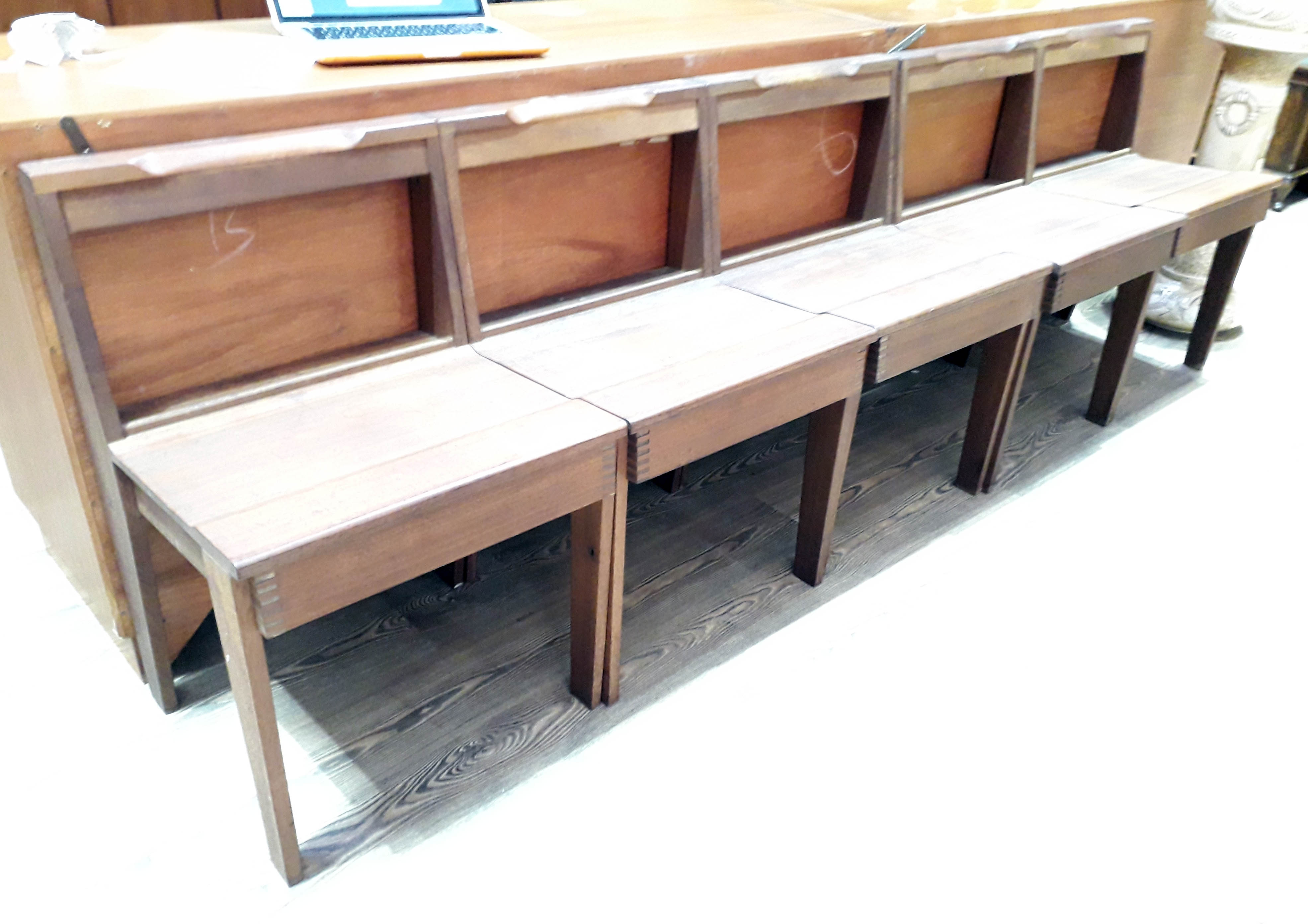 A set of five mid 20th century teak chairs with visible finger joints.