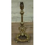 A brass lamp base in the manner of Christopher Dresser, height 41cm.