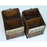 A pair of late Victorian pierced brass and oak letter racks.