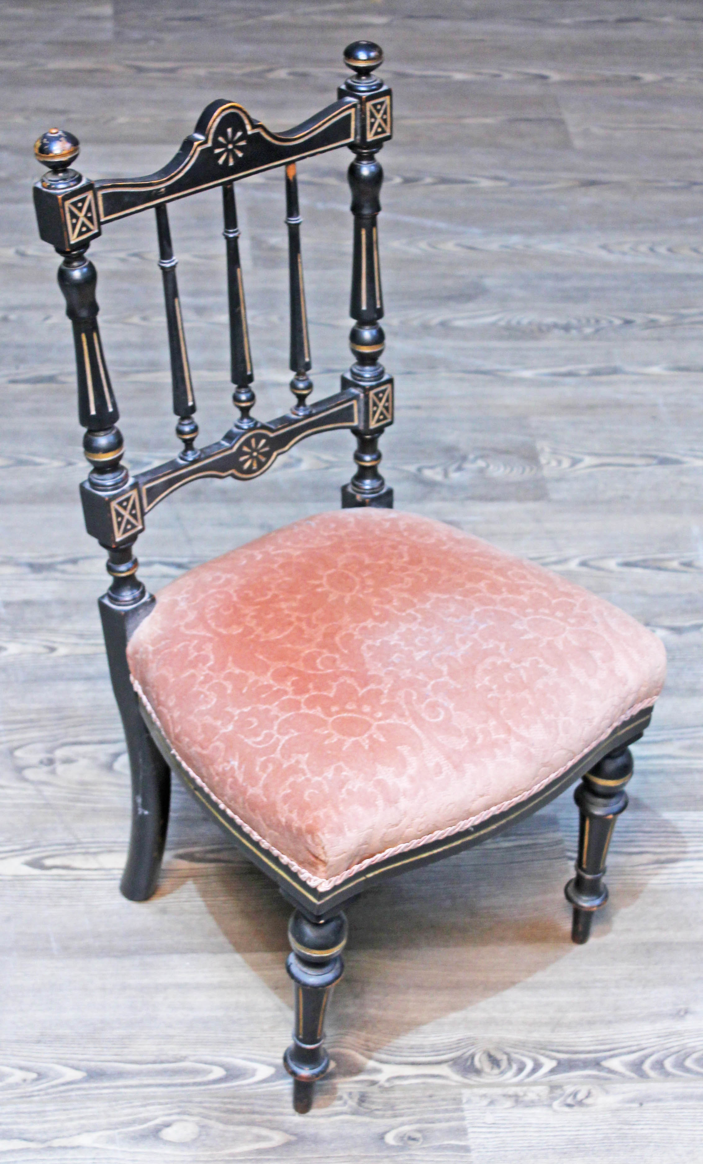 A child's late Victorian Aesthetic style chair, ebonised and parcel gilt, height 73cm.