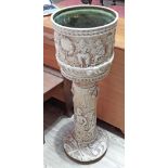 A Bretby Arts & Crafts pottery jardiniere and stand, height 98cm.