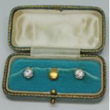 A pair of 18ct gold buttons set with colourless stones, mathced with a 9ct gold button, gross wt.