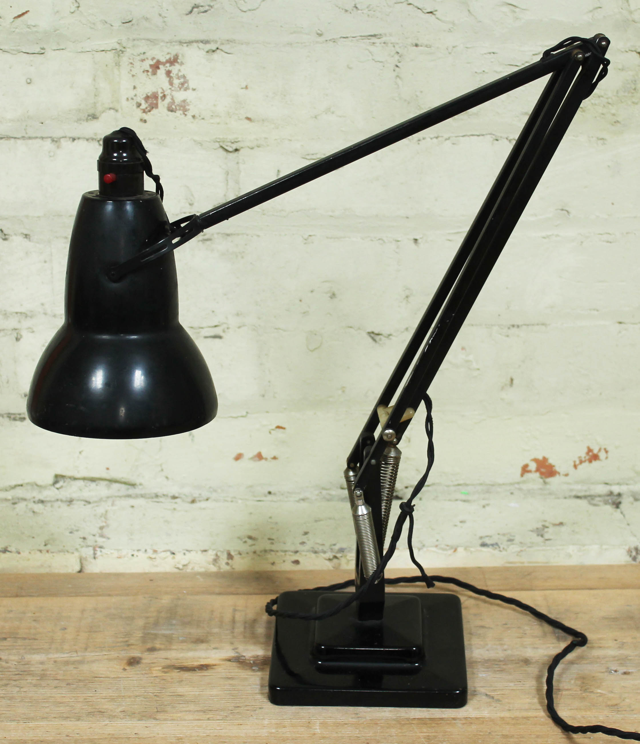 A Herbert Terry & Sons black anglepoise lamp.