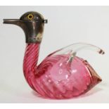 A Victorian novelty claret jug formed as a cranberry glass duck with silver head having, Cornelius