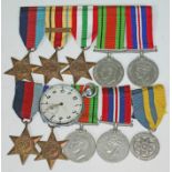 Various WWII medals and a G.S.T.P. military pocket watch.