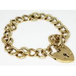 A hallmarked 9ct gold link bracelet with heart shaped lock, length 18cm, wt. 22.5g.