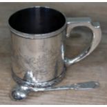 A Tiffany & Co Sterling silver bright cut engraved tankard and non matching Georgian Silver spoon.