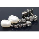 A pair of Victorian pearl and diamond earrings.