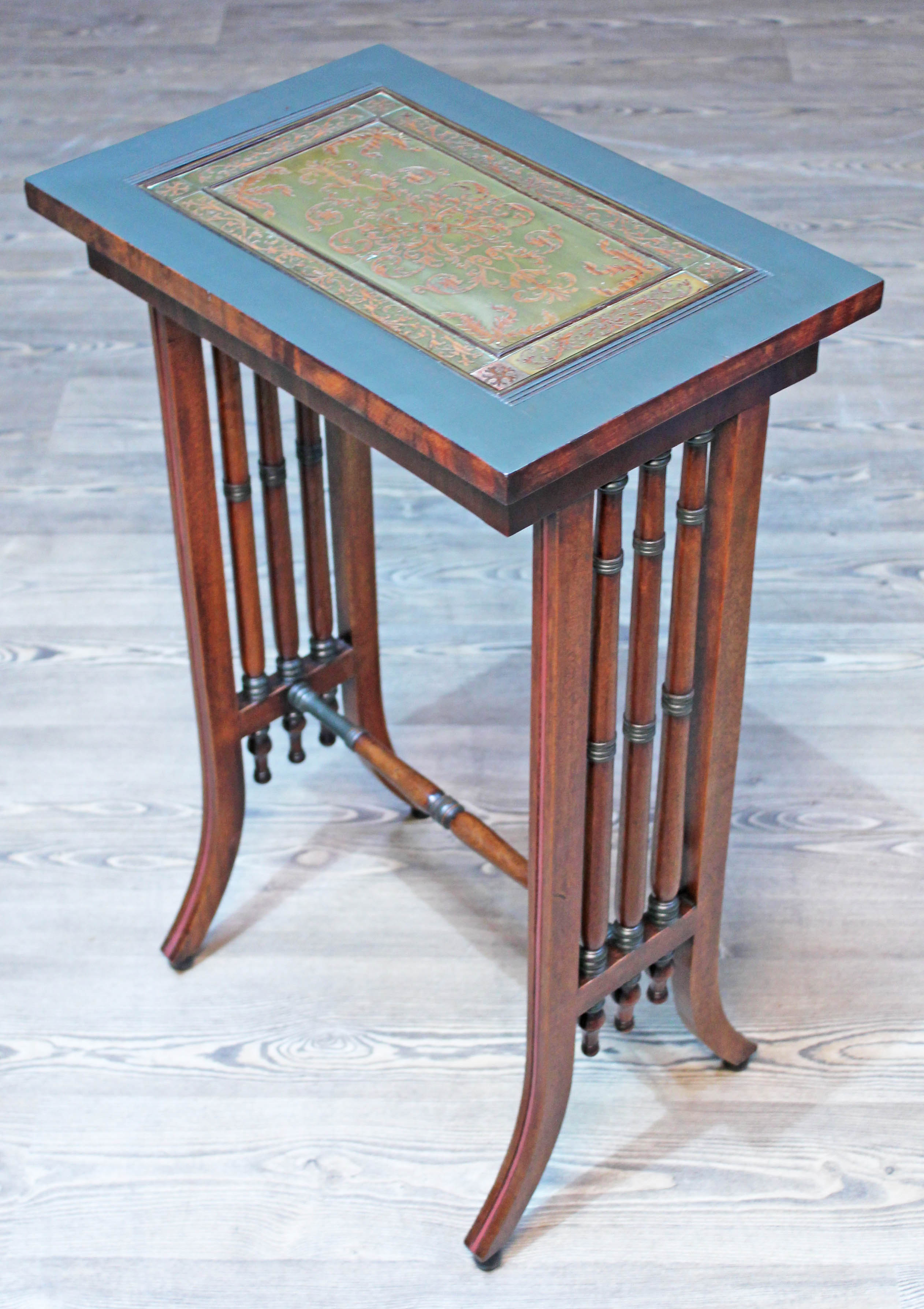 A Regency and later mahogany side table with pierced brass inlaid top, turned supports and splayed