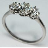 A three stone diamond ring, total approx. diamond wt. 0.95 carats, band marked 'W18ct', gross wt.