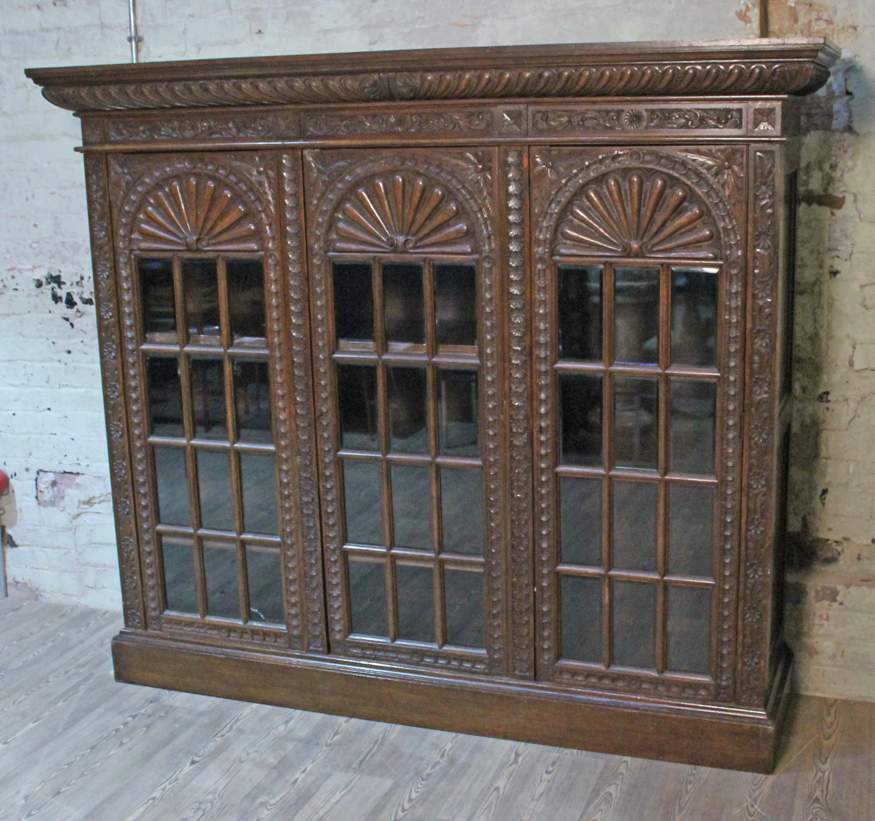 A late Victorian large carved oak glazed bookcase having gadrooned cornice, acanthus frieze, - Image 2 of 2