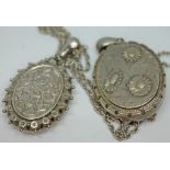 Two victorian locket pendants, one on chain.