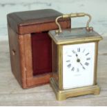 A late 19th century brass carriage clock, the dial inscribed 'Aldred & Son', with leather case.