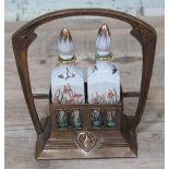 A reproduction Art Nouveau style brass perfume casket with pottery bottles, height 22cm.