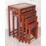 A Chinese carved hardwood nest of tables, early 20th century, height 70cm. Condition - very good,