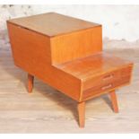 A Vanson teak sewing box with lift top , two drawers and square tapered legs, length 74cm, depth