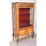 A French style walnut cross banded and marquetry inlaid glazed cabinet with gilt metal mounts and