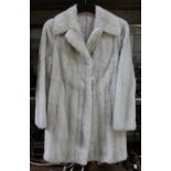 A vintage half length blonde mink fur coat, size 6 - 8 UK. The fur coat doesn't present any signs of