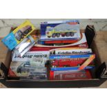 A box of boxed die-cast trucks to include Corgi, Coca Cola, etc.