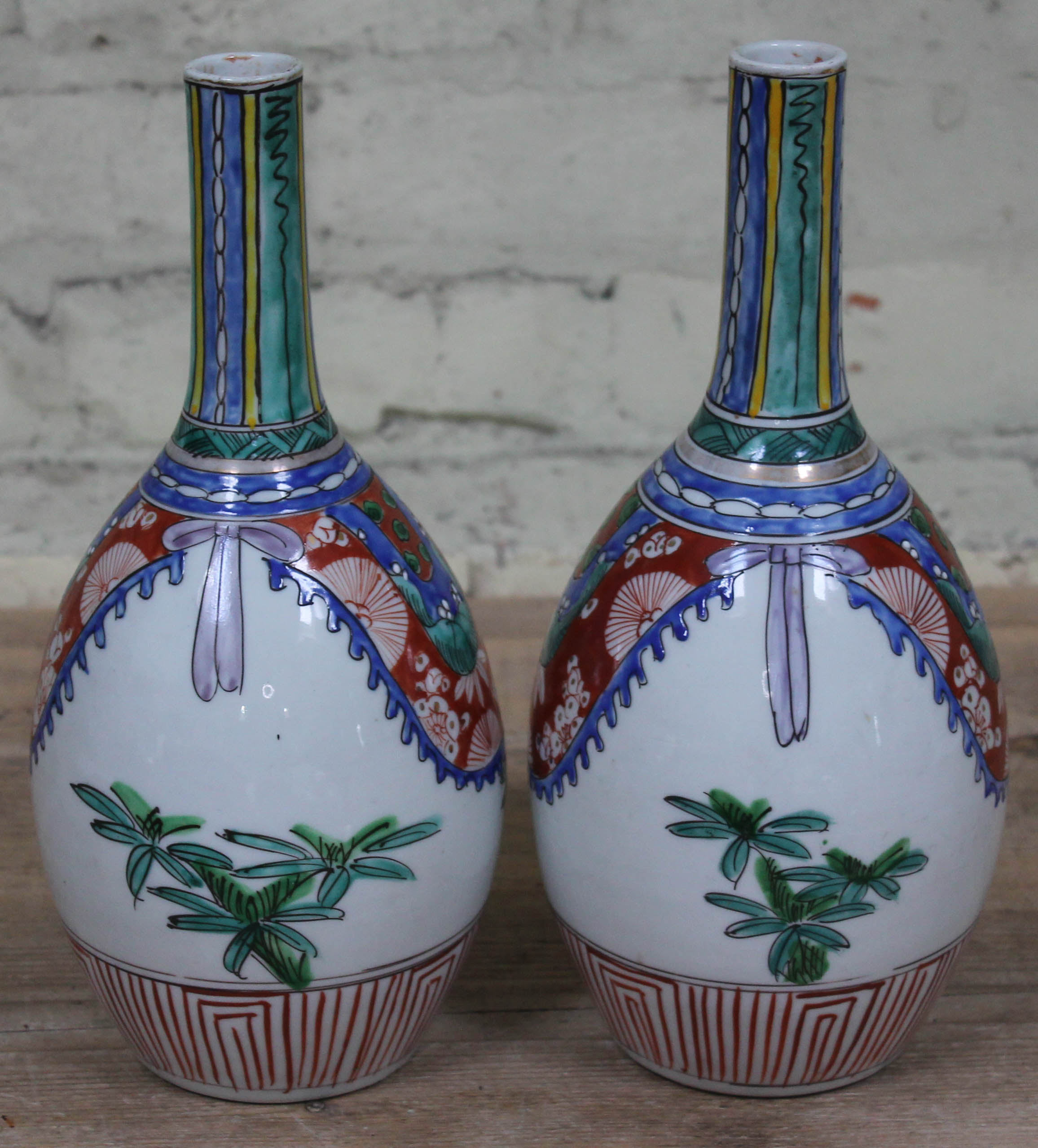 A pair of Japanese Arita porcelain bottle vases, height 30.5cm. Condition - one having crazed line - Image 3 of 3
