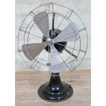 A pre war Revo electric oscillating fan.