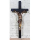 A large plaster and wood crucifix, length 110cm.