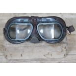 A pair of vintage motor cycle goggles.