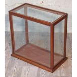 A glass display case, length 59cm, depth 32cm & height 57cm.