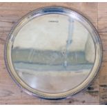 A hallmarked silver tray, diam. 25.5cm, wt. 14oz.