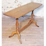 An Ercol Golden Dawn elm sofa table, length 130.5cm, depth 45cm & height 75.5cm.