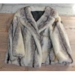 A vintage blonde with hints of brown mink fur jacket, with 2 side pockets, size 6 - 8 UK. The fur is