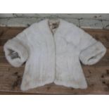 A vintage blonde mink fur cape, having M. Fletcher Southport label, size 8 UK. The fur cape is in