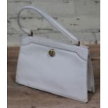 A vintage cream leather handbag by Asprey.