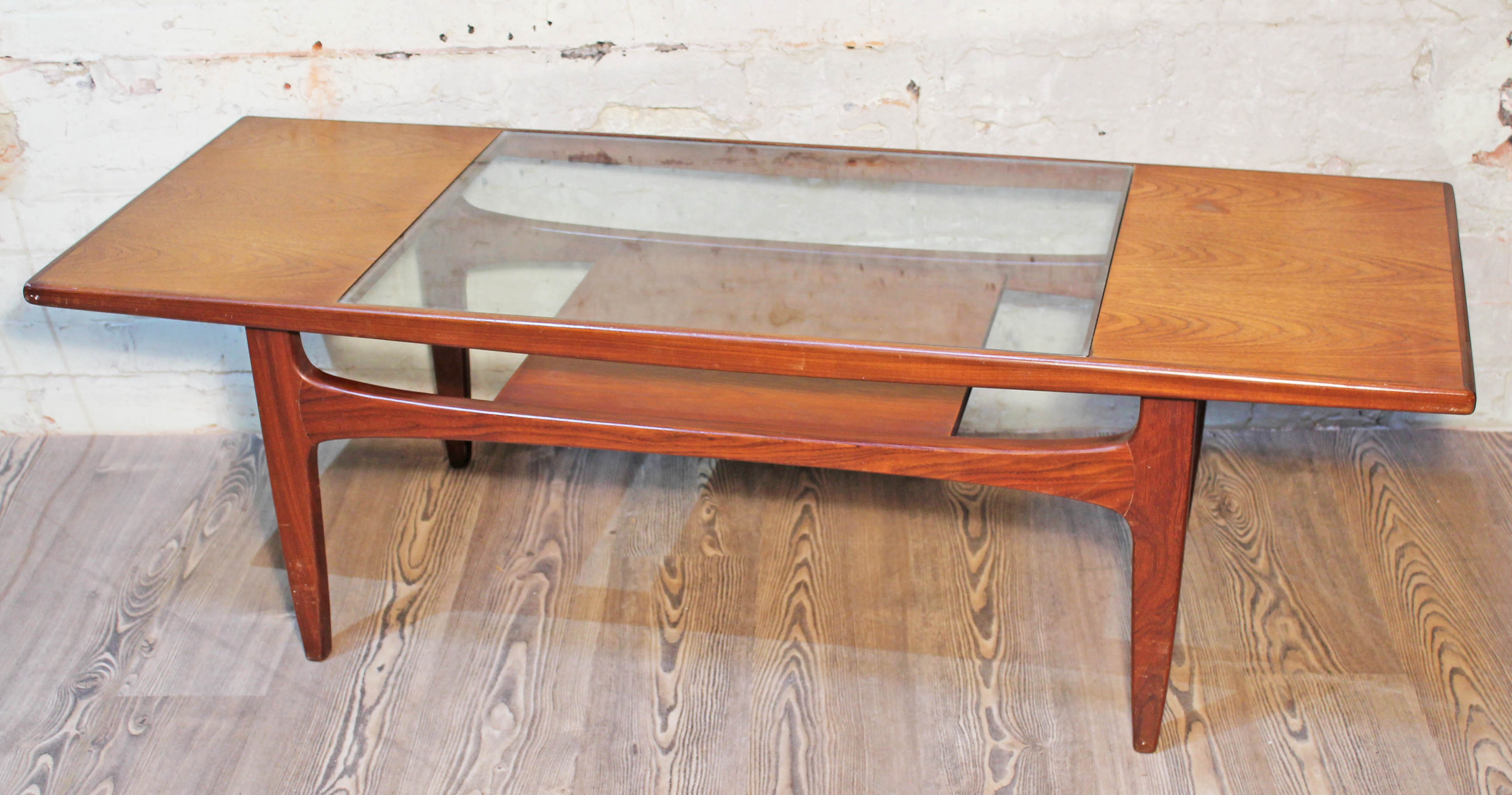 A G-Plan teak and glass top coffee table.