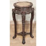 A Chinese marble top carved hardwood plant stand, 19th century, height 92cm. Condition - old