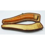A vintage butterscotch amber and meerschaum cheroot holder pipe and case.