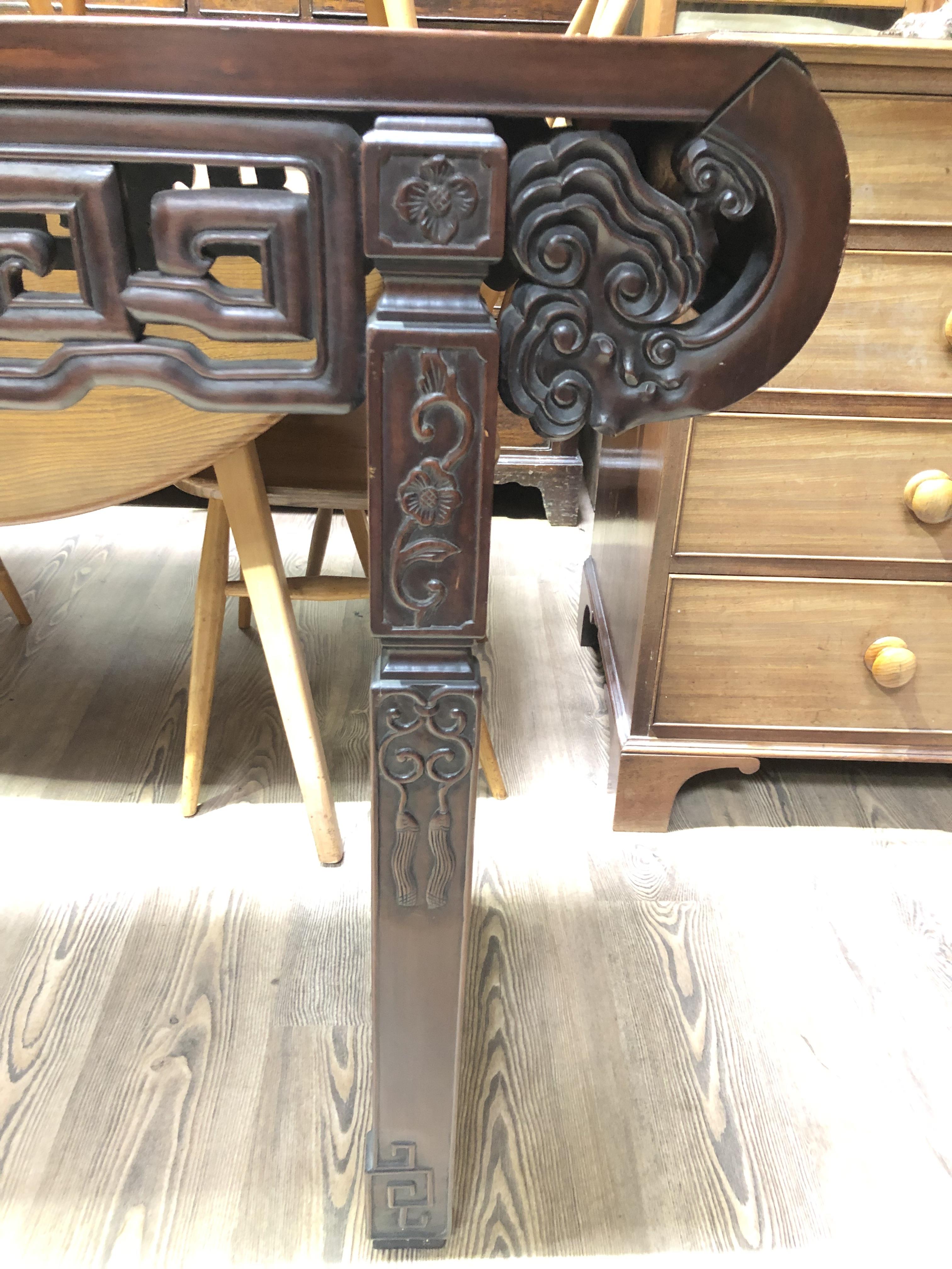 A Chinese altar table, late 19th century, carved frieze with scroll ends and carved square legs, - Image 8 of 12