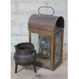 A brass lantern and a cast iron cauldron.