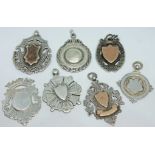 A group of seven hallmarked silver fobs.