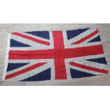 A group of four vintage flags comprising three Union Jacks and one United States, 158cm x 81cm,